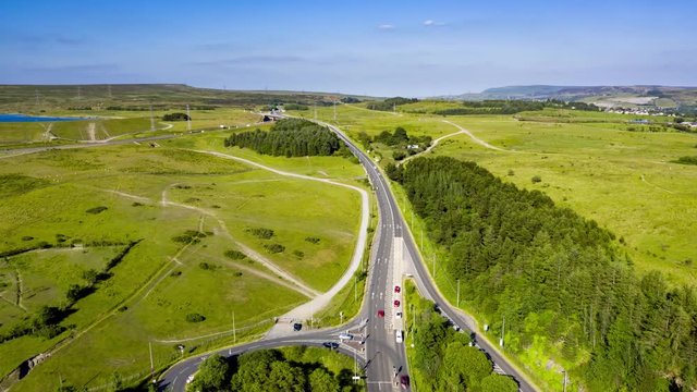 Aerial hyperlapse of traffic moving along a newly constructed, busy, dual carriageway road (A465)