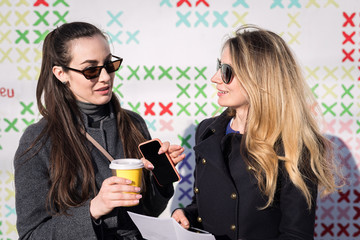 Happy caucasian blonde girl drinking