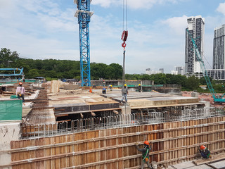 Naklejka premium Building substructure and super-structure under construction using the open cut method. It is commencing after the foundation stage using the conventional method