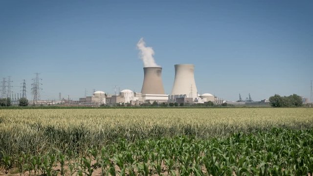 Doel Nuclear Power Station with two smoking cooling towers