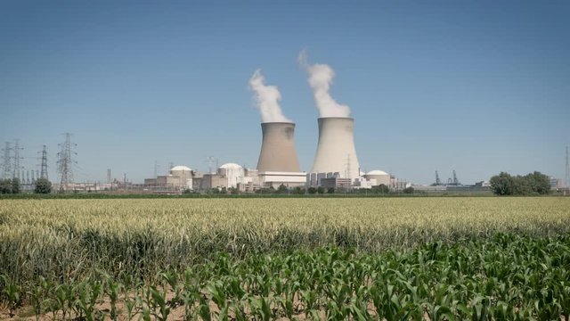 Doel Nuclear Power Station with two smoking cooling towers