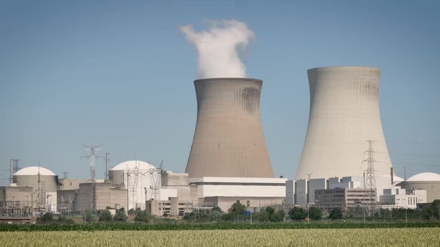 Doel Nuclear Power Station with two smoking cooling towers