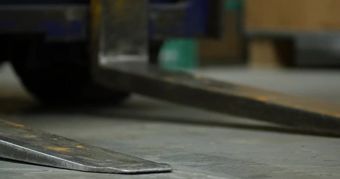 Forklift forks in a warehouse