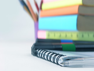 close up.white ball point pen on the notebook .photo with copy space