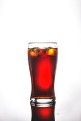 glass of cola, lemonade with ice on a white background