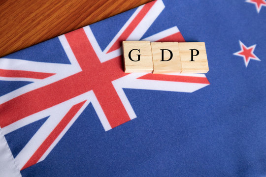 Gross Domestic Product Or GDP Of Australia In Wooden Block Letters On Australian Flag.