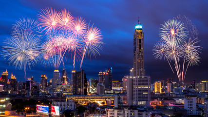 Firework with Bangkok night light cityscape with modern building at twilight time