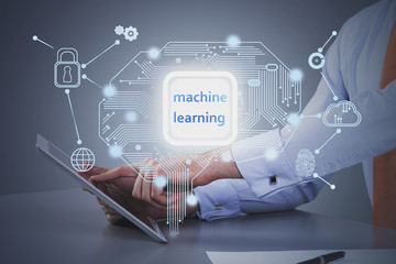 Businessman with tablet at table, machine learning