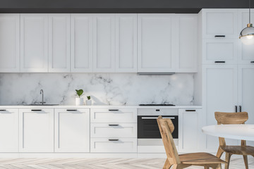 White and marble kitchen with table - obrazy, fototapety, plakaty