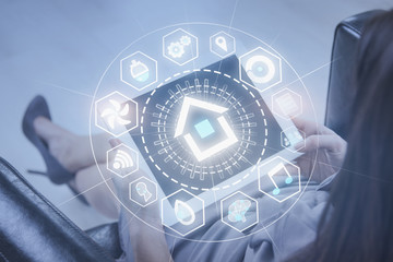 Top view of woman in armchair, smart home