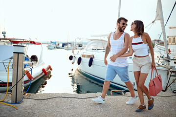 Man and woman going on the yachts at vacation .