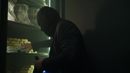 Man in mask robbing a bank