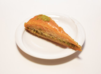 Pistachios, walnuts Baklava white background. Jewish, turkish, arabic traditional national dessert. Havuc Dilim Baklava