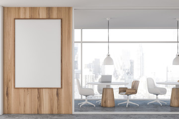 Light wooden coworking office with poster