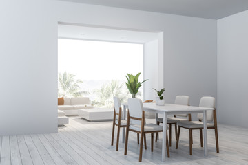 White dining room and living room corner