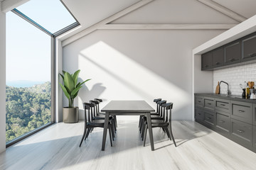 Attic Scandinavian kitchen interior with table