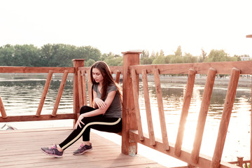 Girl resting after sports. Concept of sport, healthy lifestyle, body care.