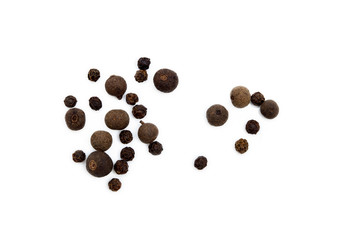 Scattered allspice and pepper isolated on white background