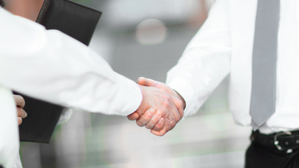 closeup .handshake business people in the office