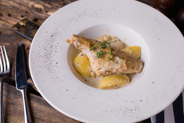 Duck leg confit with potatoes and oregano