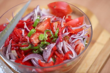 Tomatoes of different varieties with different juices in glass jars homemade preparations