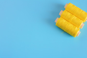 spools of thread close up, sewing supplies, place for text