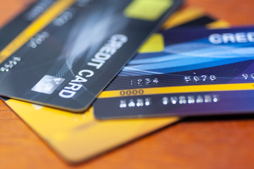 Obraz premium Credit cards on table. Business techology do moneyless transaction by plastic cards for buy sell offline and online shopping.