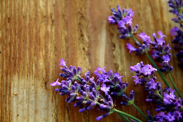 lavender flower displayed and sitting on a wooden table no people stock photo