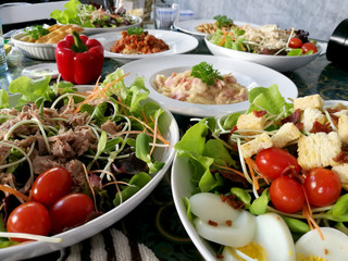 Varietes of foods are placed on the table.