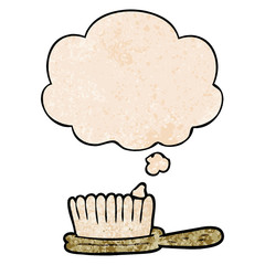 cartoon hairbrush and thought bubble in grunge texture pattern style