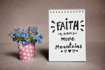 Faith can move mountains - christian lettering with blue flowers, motivation biblical phrase