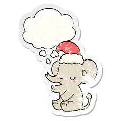 cute christmas elephant and thought bubble as a distressed worn sticker