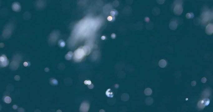 Ocean sea spray water wave bubbles turqoise marine background slow motion