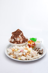 Shaved ice dessert with sweet toppings