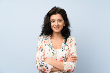Young woman over isolated blue background laughing