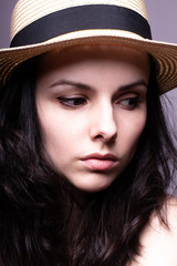 beautiful girl in the hat portrait studio