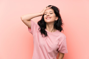 Young woman over isolated pink background laughing