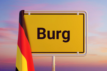 Burg. Gelbes Schild/Ortsschild. Flagge von Deutschland hängt darüber. Himmel mit Sonnenuntergang oder Sonnenaufgang
