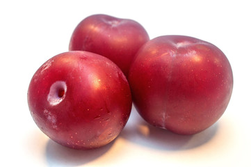 Plums isolated on white background