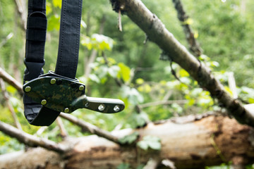 The knife in its sheath. On my belt in a holster. Backpack hike.
