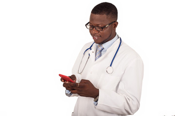 Male doctor in medical uniform holding a mobile phone