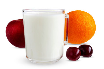 Mug with milk on the background of orange apple and cherries.