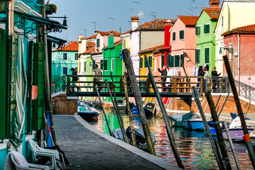 Fototapeta na wymiar Street with colorful buildings in Burano island, Venice, Italy. April 2012
