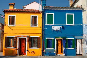 Street with colorful buildings in Burano island, Venice, Italy.  April 2012