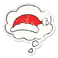 cartoon christmas hat and thought bubble as a distressed worn sticker