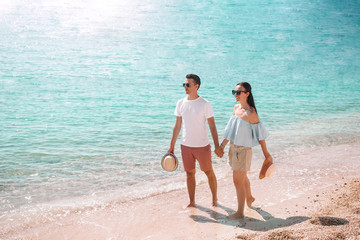 Young couple on white beach during summer vacation.