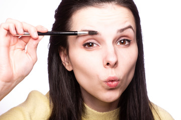 Obraz premium attractive young woman doing makeup