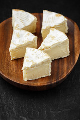 camembert soft cheese sliced. brie cheese. Italian, French cheese. macro shot.