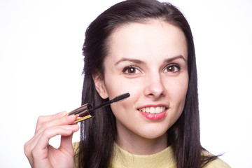 Obraz premium attractive young woman doing makeup