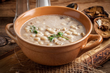 Mushroom soup on a wooden table.